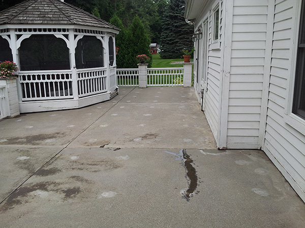 patio before concrete services behind white home